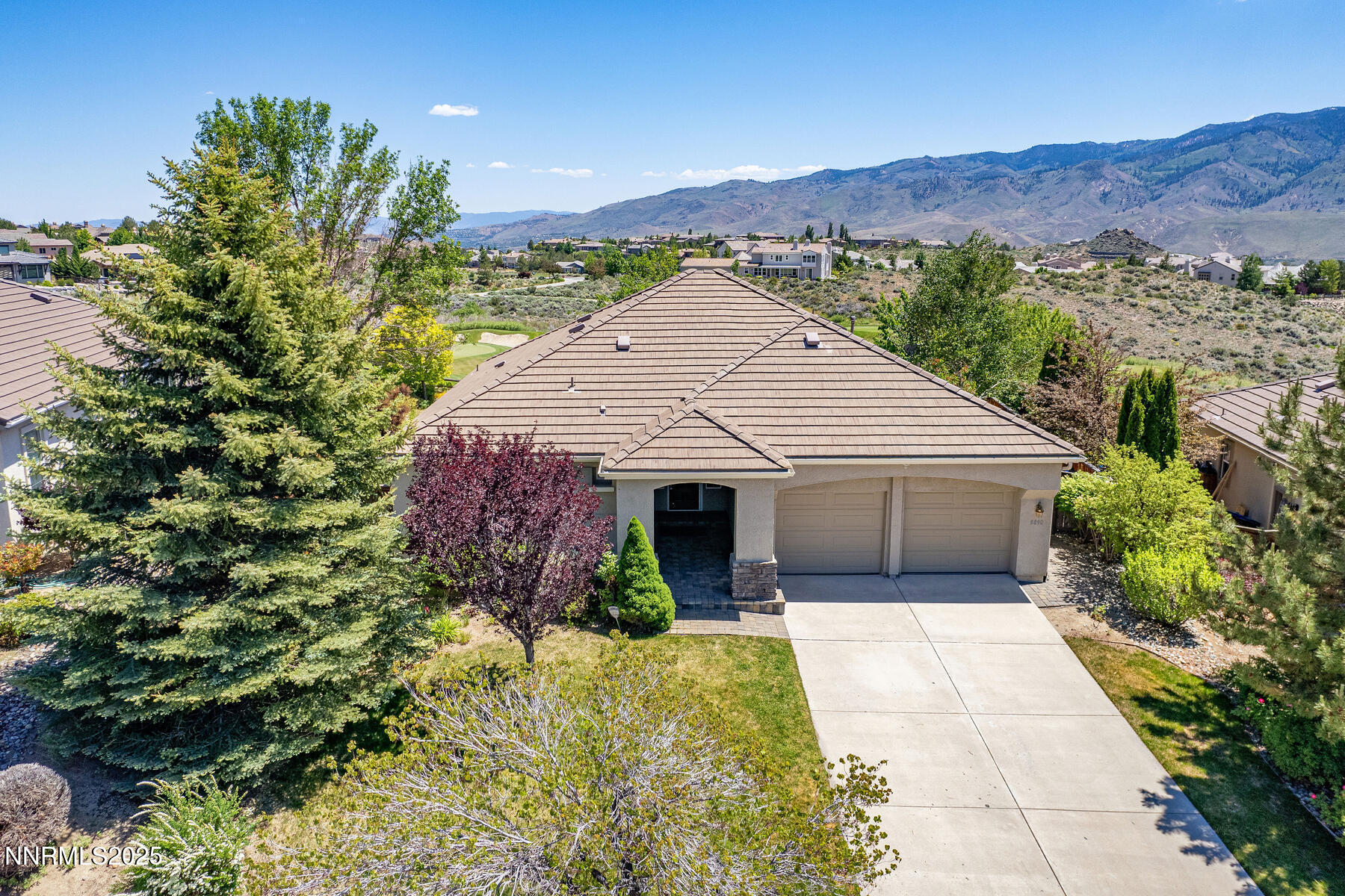 a view of a house with a yard and a large window