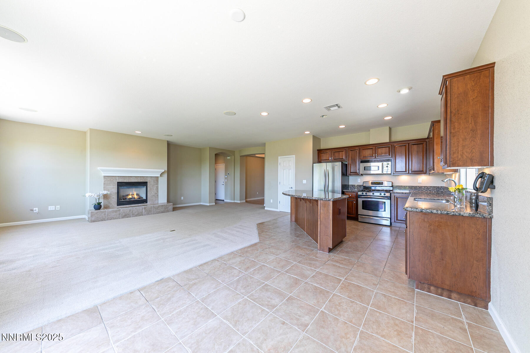 8890 Chipshot Trail Reno, NV 89523 - Photo 15 of 36 a living room with furniture and a fireplace