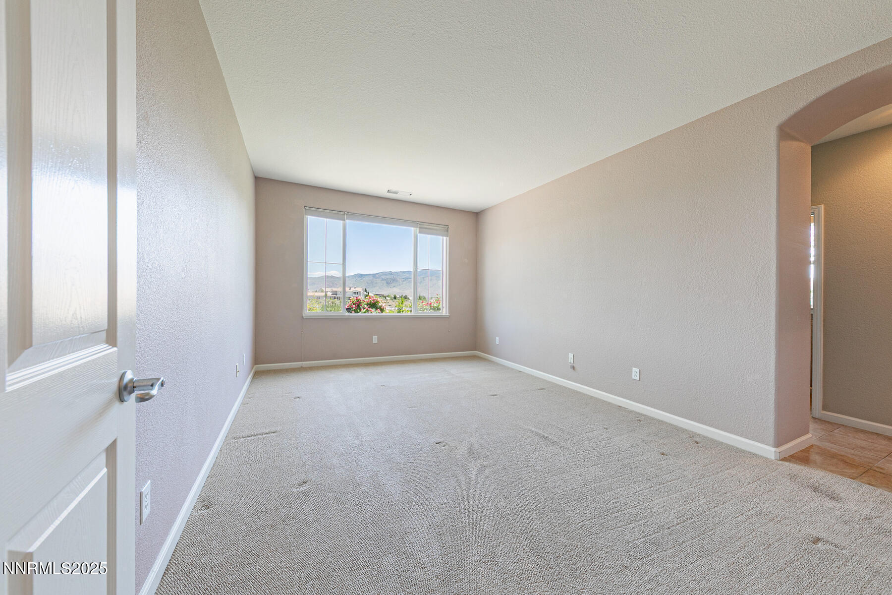 8890 Chipshot Trail Reno, NV 89523 - Photo 21 of 36 a view of an empty room with a window