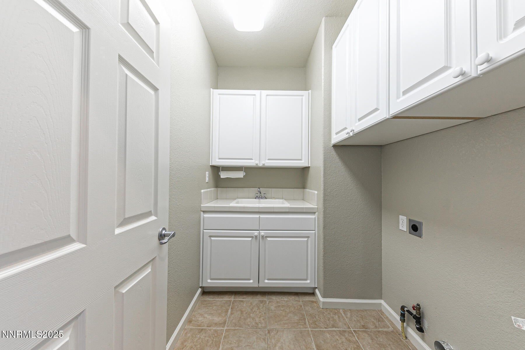 8890 Chipshot Trail Reno, NV 89523 - Photo 23 of 36 a bathroom with a sink a toilet and a window