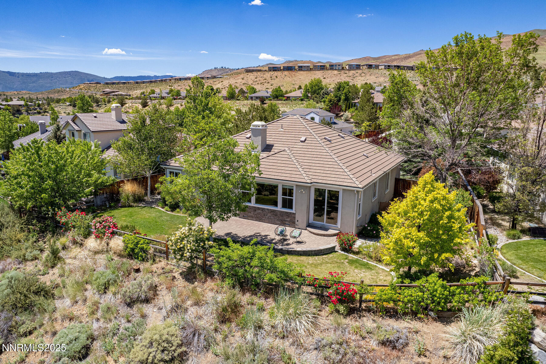 8890 Chipshot Trail Reno, NV 89523 - Photo 5 of 36 a view of a house with a big yard and large tree
