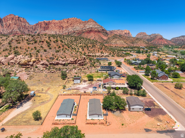 464 Jessop Avenue Hildale, UT 84784 - Photo 55 of 73 Expansive property featuring clear skies and a red rock mountain backdrop