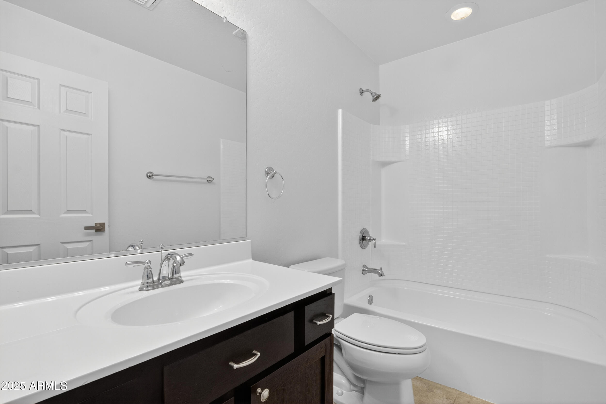 2565 East Southern Avenue, Unit 135 Mesa, AZ 85204 - Photo 15 of 32 a bathroom with a sink a toilet and a large mirror
