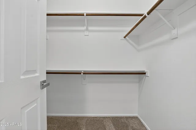 a spacious bathroom with a bathtub sink and mirror