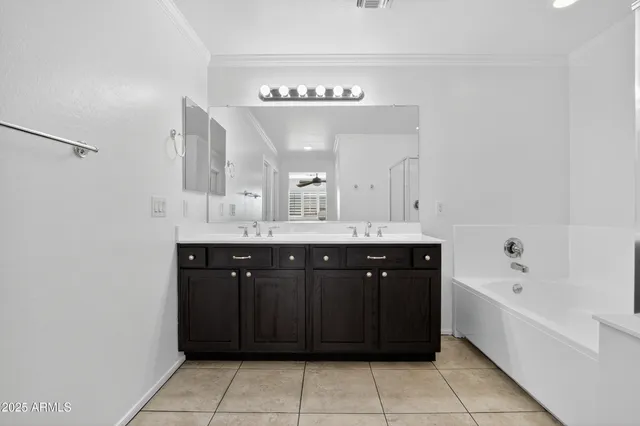 a spacious bathroom with a mirror a shower and vanity