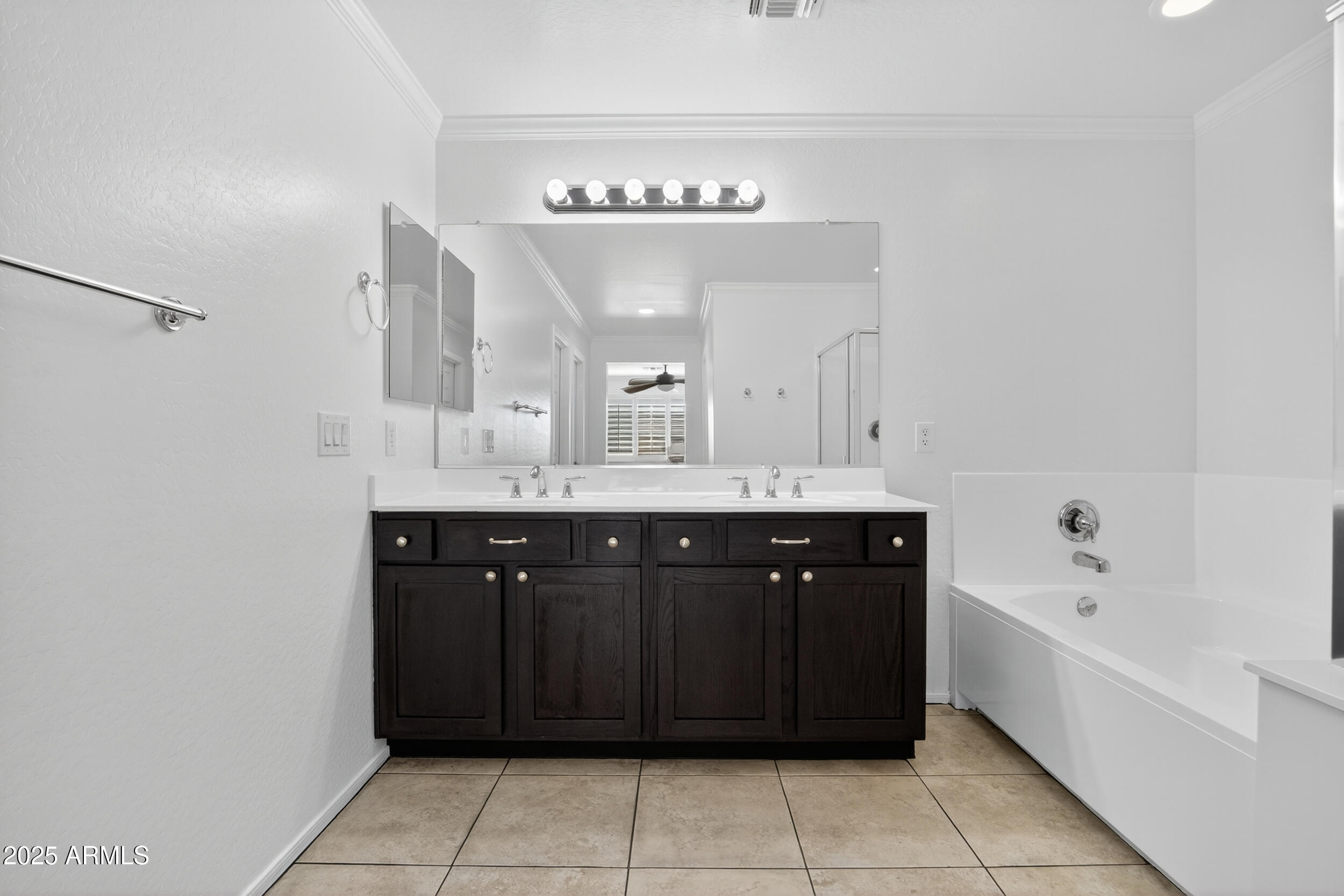 2565 East Southern Avenue, Unit 135 Mesa, AZ 85204 - Photo 22 of 32 a spacious bathroom with a bathtub sink and mirror