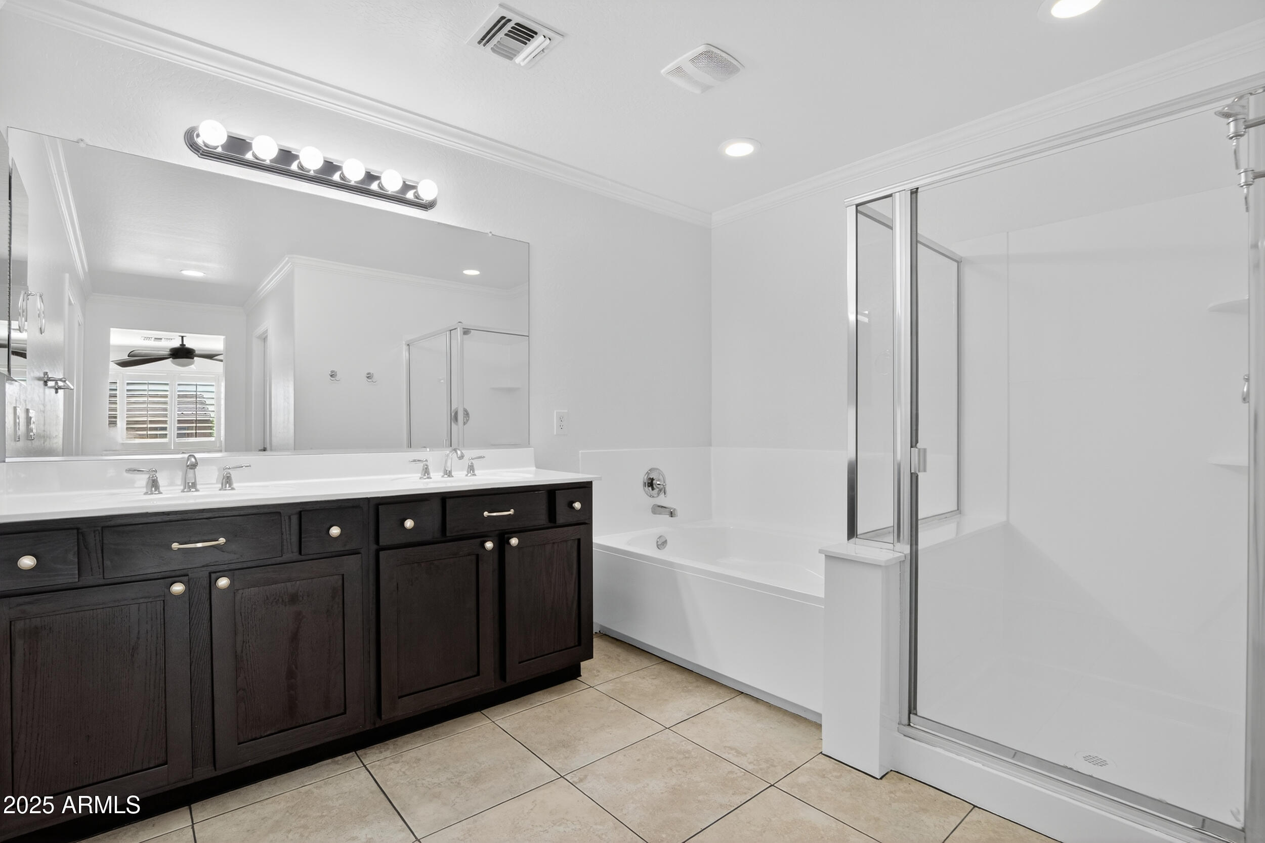 2565 East Southern Avenue, Unit 135 Mesa, AZ 85204 - Photo 23 of 32 a spacious bathroom with a mirror a shower and vanity