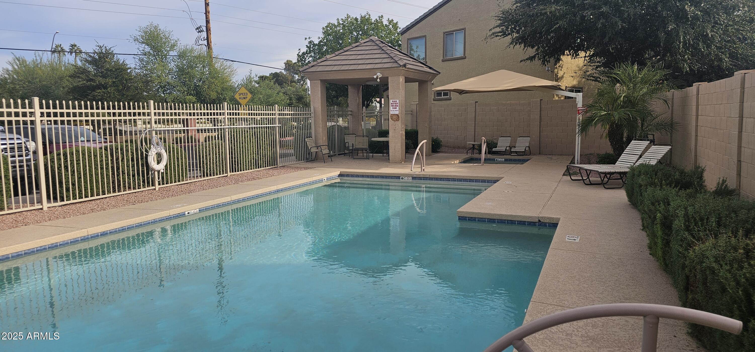 2565 East Southern Avenue, Unit 135 Mesa, AZ 85204 - Photo 31 of 32 swimming pool view with a seating space