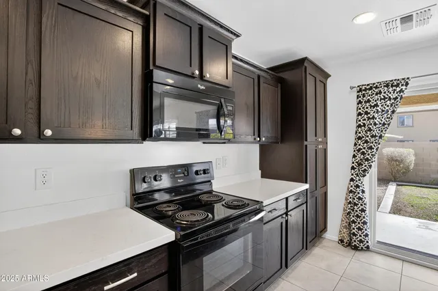 a kitchen with stainless steel appliances a stove and a refrigerator