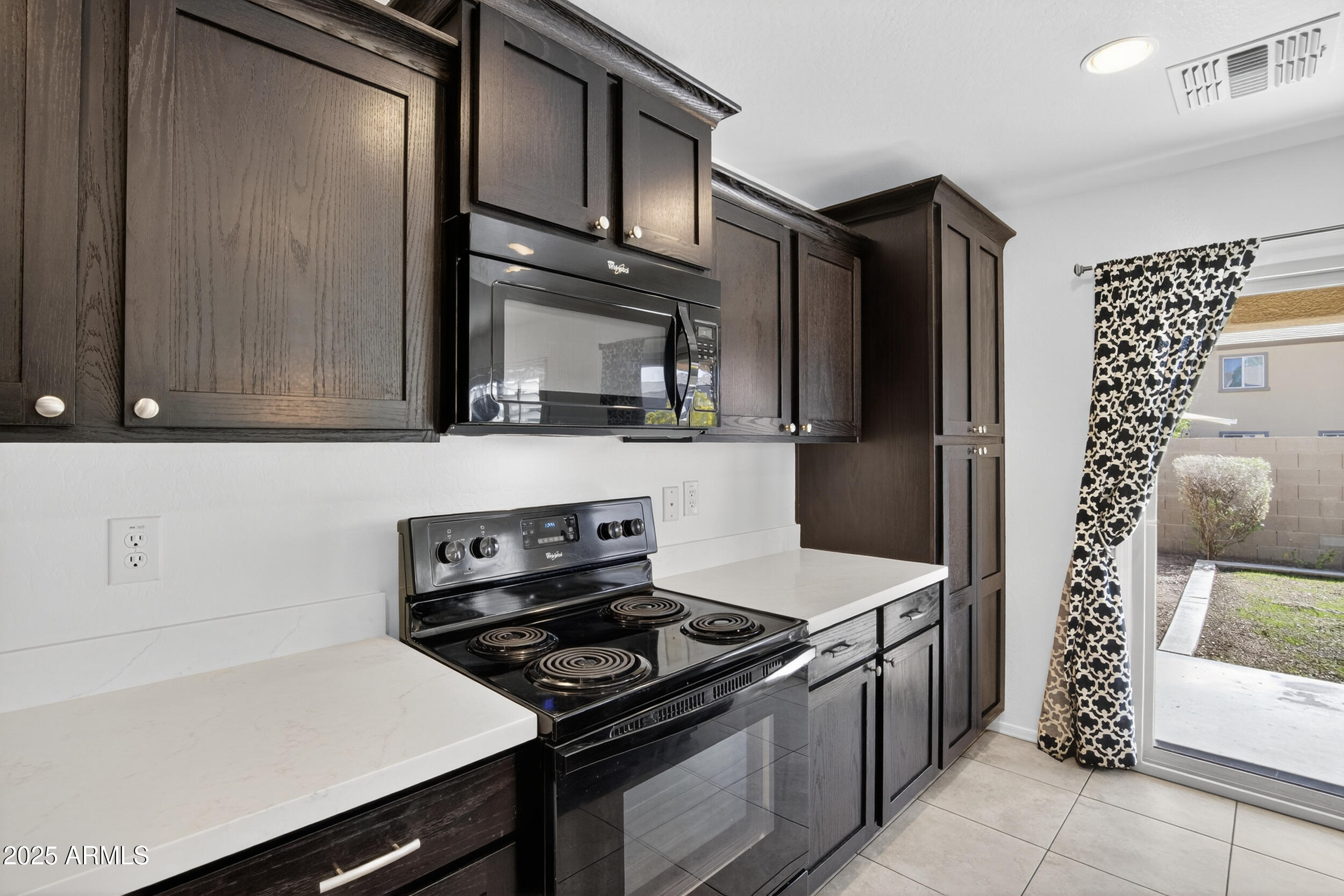 2565 East Southern Avenue, Unit 135 Mesa, AZ 85204 - Photo 7 of 32 a kitchen with stainless steel appliances a stove and a refrigerator