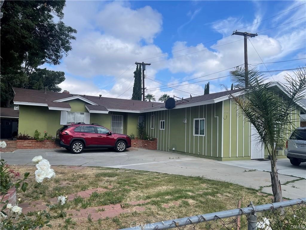 6191 Streeter Avenue Riverside, CA 92504 - Photo 1 of 8 a front view of a house with garden
