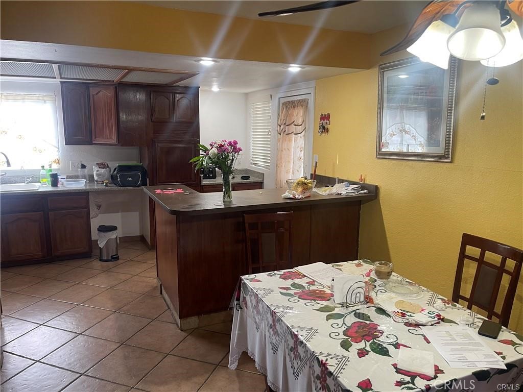 6191 Streeter Avenue Riverside, CA 92504 - Photo 4 of 8 a kitchen with a sink and cabinets