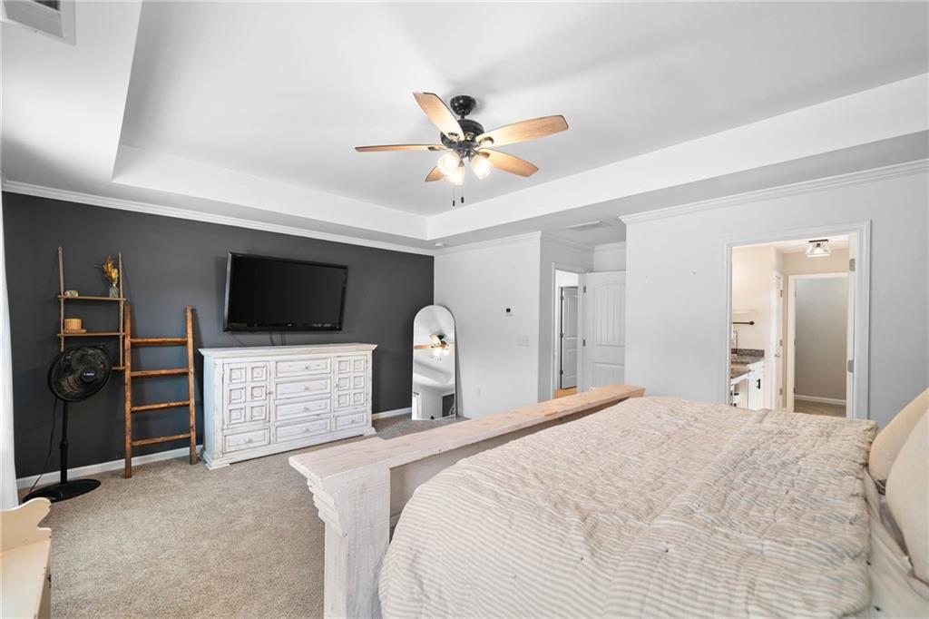 13 Four Feathers Lane Northeast Rydal, GA 30171 - Photo 30 of 51 a bedroom with a bed and a flat screen tv