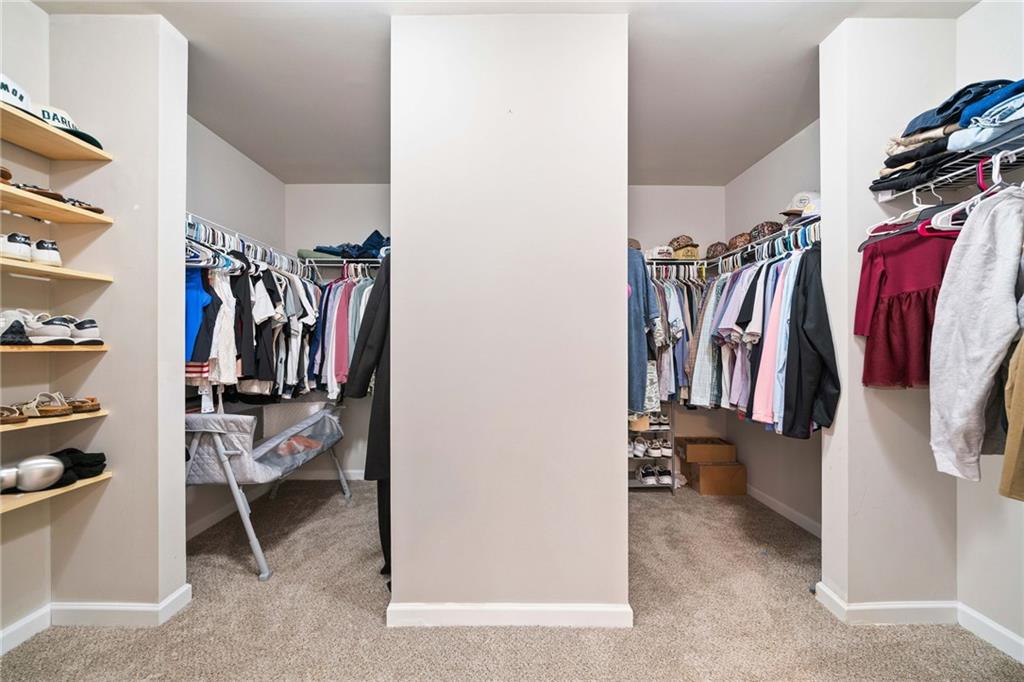 13 Four Feathers Lane Northeast Rydal, GA 30171 - Photo 33 of 51 a view of walk in closet with clothes and shoes