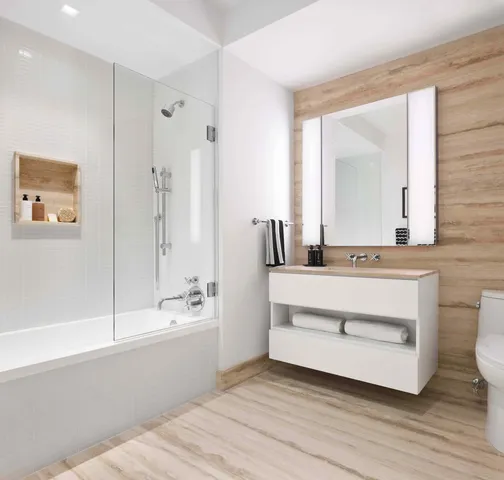 a bathroom with a double vanity sink a mirror and a bathtub