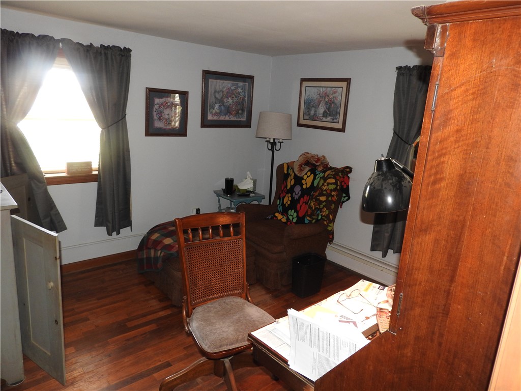 2185 East Loy Road Piqua, OH 45356 - Photo 10 of 19 This inviting room features warm hardwood floors and abundant natural light.