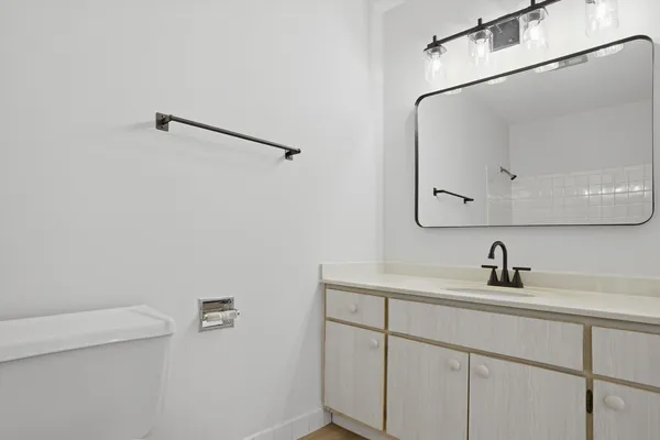 a bathroom with a sink and mirror