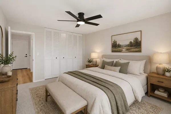 a bed room with a bed and a chandelier