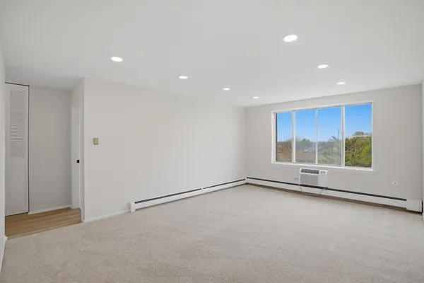 a view of an empty room with a window