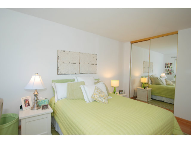 1811 Randall Road San Mateo, CA 94402 - Photo 13 of 21 a bedroom with a bed and a lamp on table