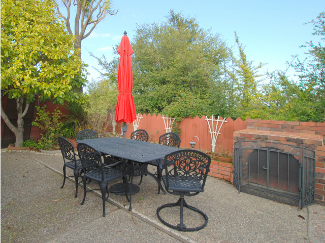 1811 Randall Road San Mateo, CA 94402 - Photo 20 of 21 a view of a backyard with table and chairs