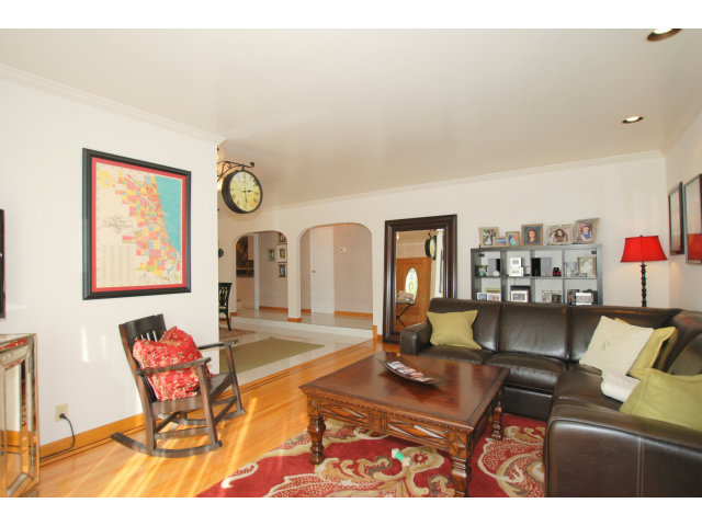 1811 Randall Road San Mateo, CA 94402 - Photo 3 of 21 a living room with furniture a rug and a wall painting
