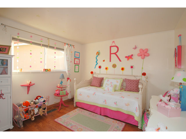 1811 Randall Road San Mateo, CA 94402 - Photo 10 of 21 a bedroom with a bed a couch and dresser