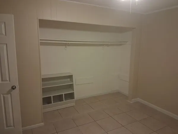 a view of an empty walk in closet