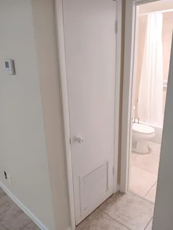a view of a bathroom from a hallway