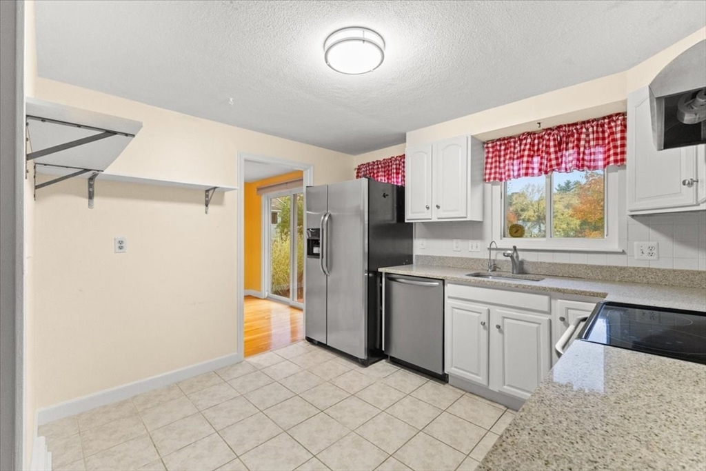 212 Washington Street, Unit 212 Canton, MA 02021 - Photo 11 of 35 a kitchen with a sink cabinets and stainless steel appliances