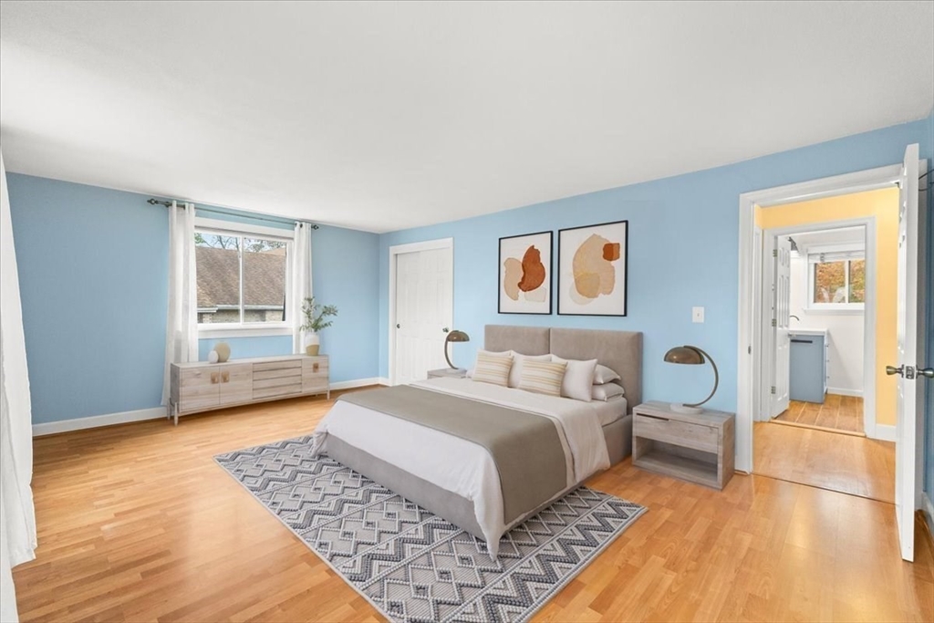 212 Washington Street, Unit 212 Canton, MA 02021 - Photo 16 of 35 a bedroom with a large bed and a window