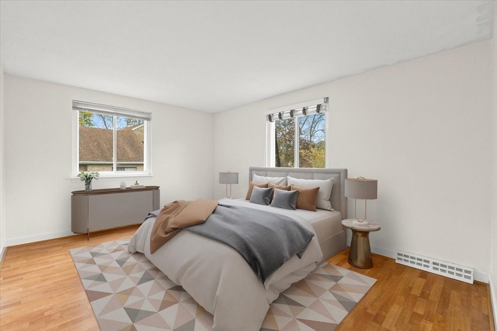 212 Washington Street, Unit 212 Canton, MA 02021 - Photo 20 of 35 a bedroom with a bed and a window