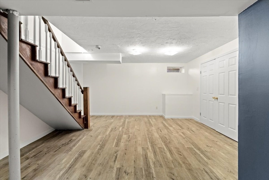 212 Washington Street, Unit 212 Canton, MA 02021 - Photo 27 of 35 a view of entryway and hall with wooden floor