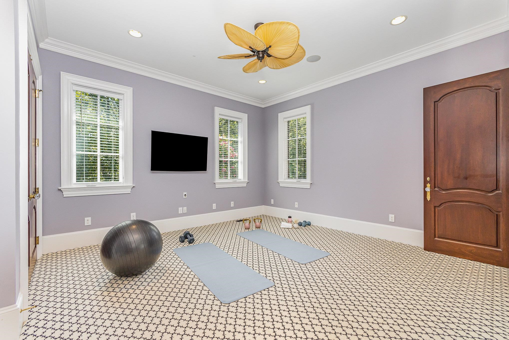 7728 Grace Cove Lane Raleigh, NC 27613 - Photo 40 of 82 a living room with a couch and a flat screen tv