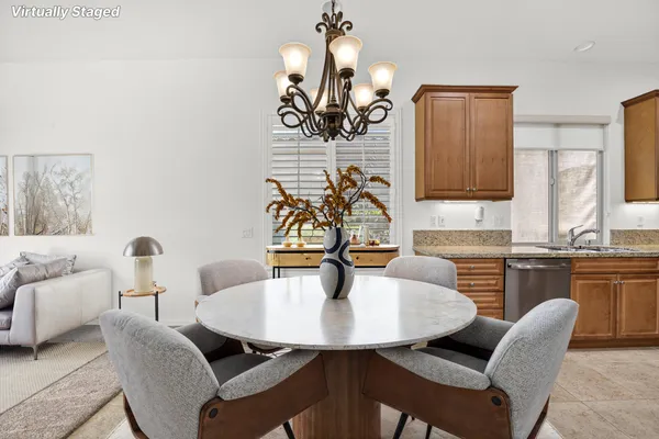 a dining room with furniture and window
