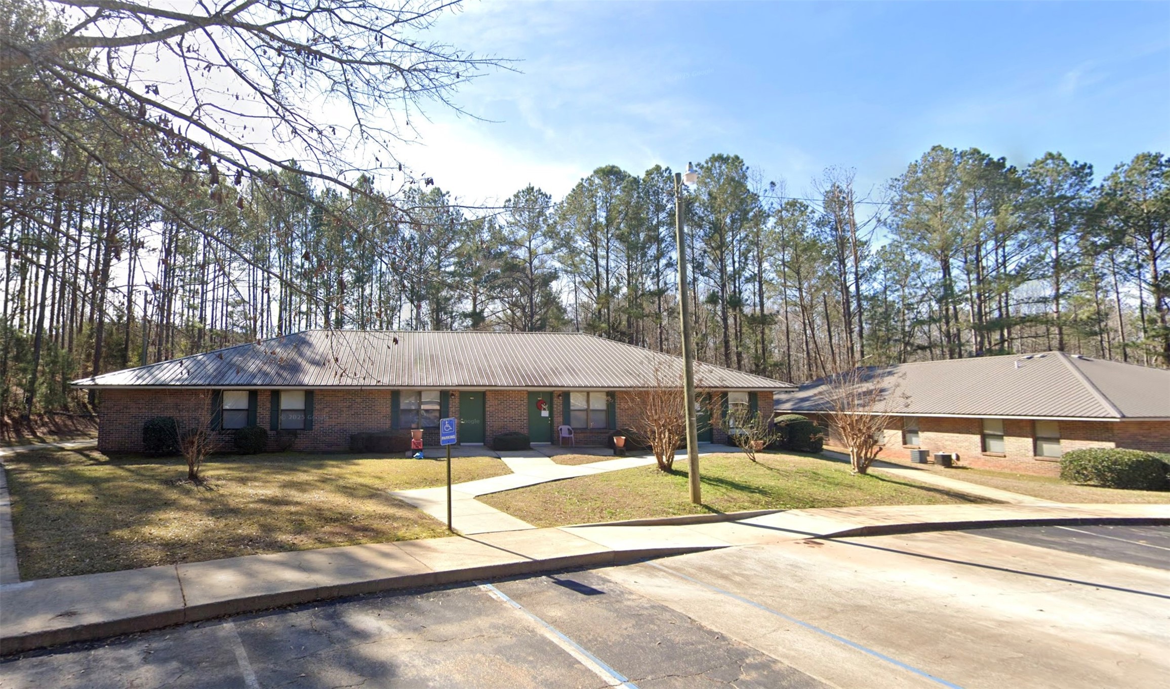 125 Robin Road Other, AL 36278 - Photo 2 of 6 a view of a patio with a table and chairs under an umbrella