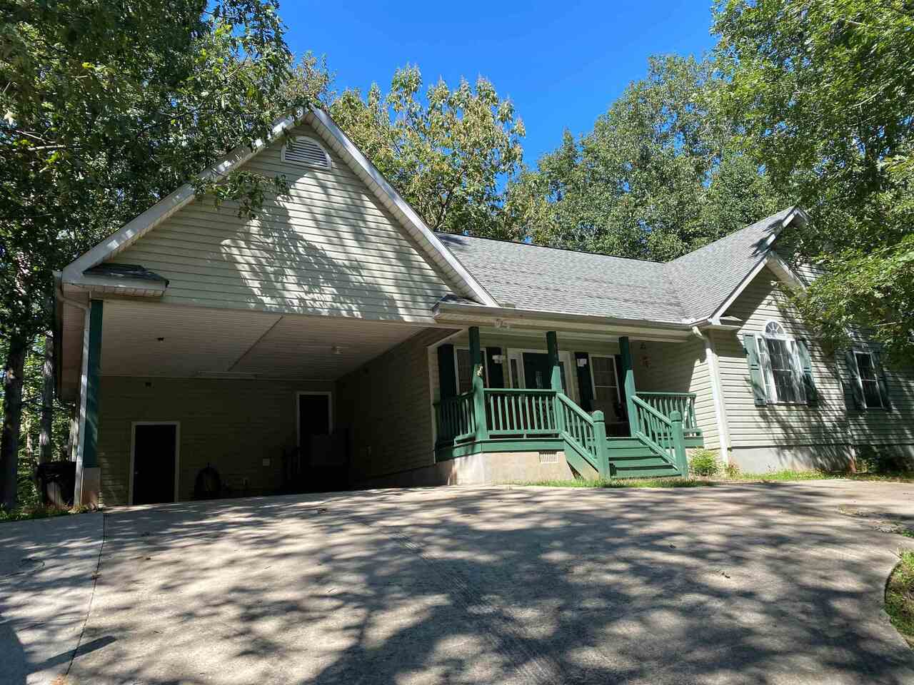 542 Washboard Road Cleveland, GA 30528 - Photo 1 of 1 a view of a house with a backyard and a garage