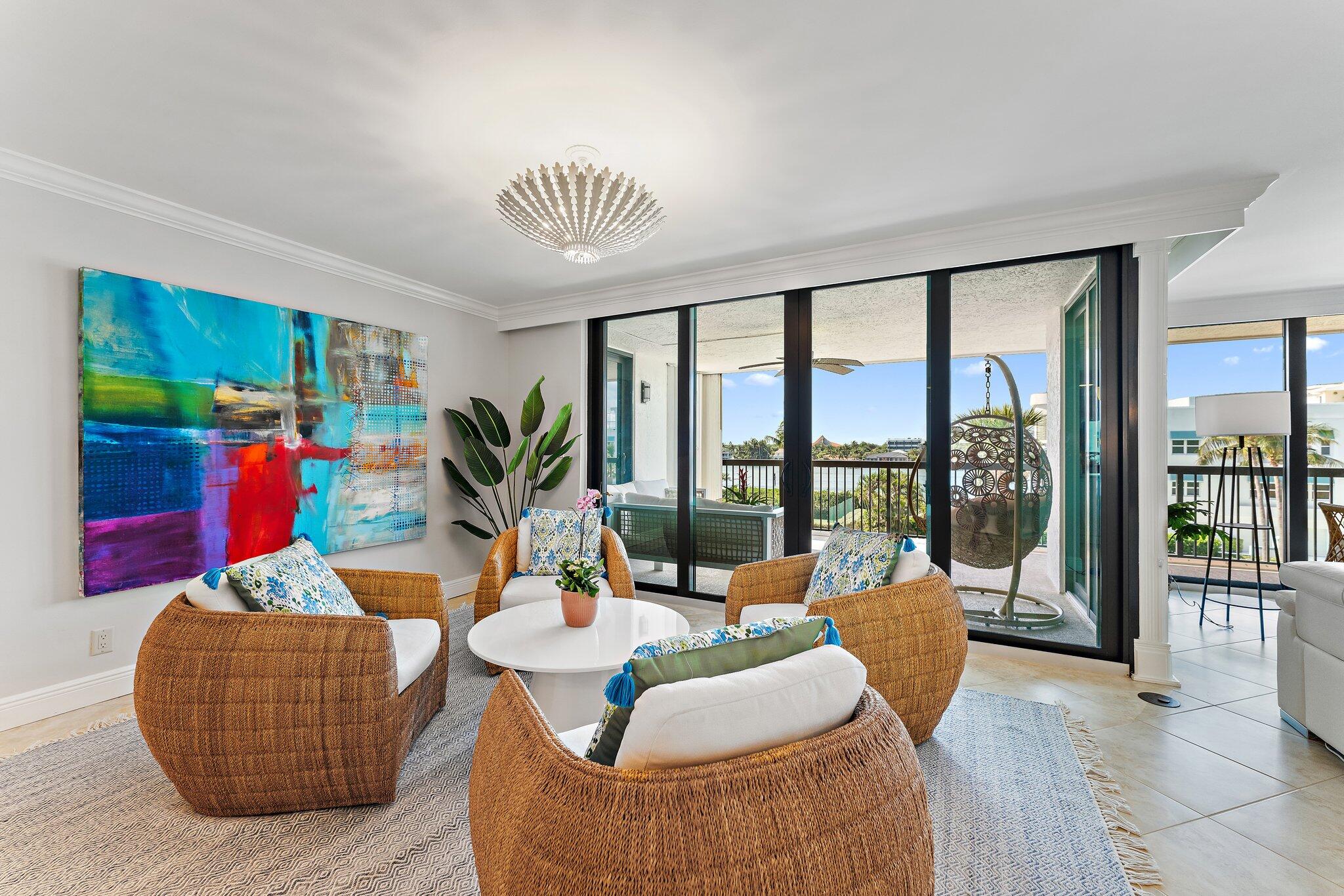 19670 South Beach Road, Unit B303 Jupiter, FL 33469 - Photo 17 of 104 a living room filled with furniture and floor to ceiling window