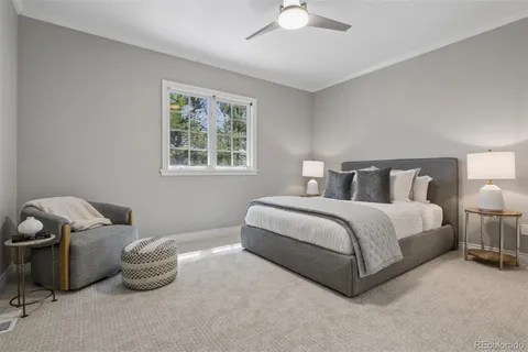 a bedroom with a bed and a night stand