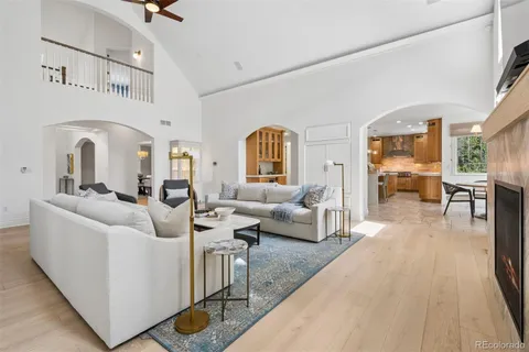 a dining hall with stainless steel appliances a dining table and chairs