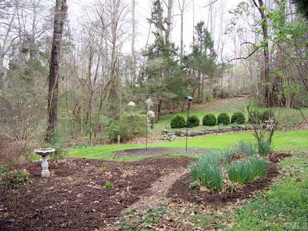 7922 McBane Mill Road Graham, NC 27253 - Photo 6 of 10 Viewed from inside or enjoyed by strolling outside, either way the gardens give pleasure