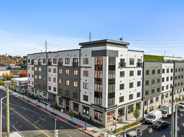 a front view of a building with glass windows