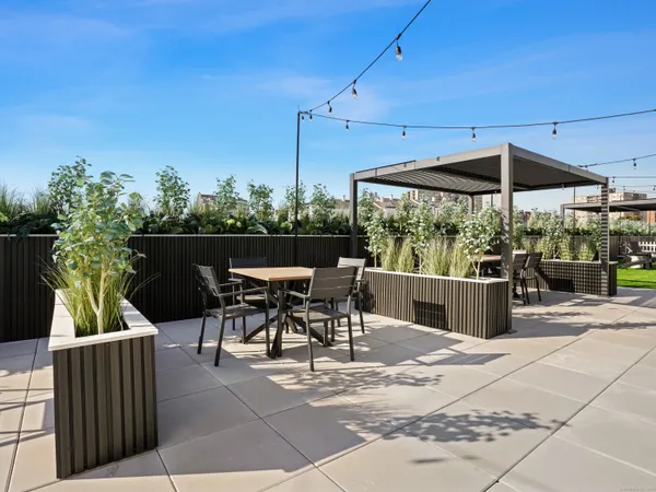 a patio with table and chairs