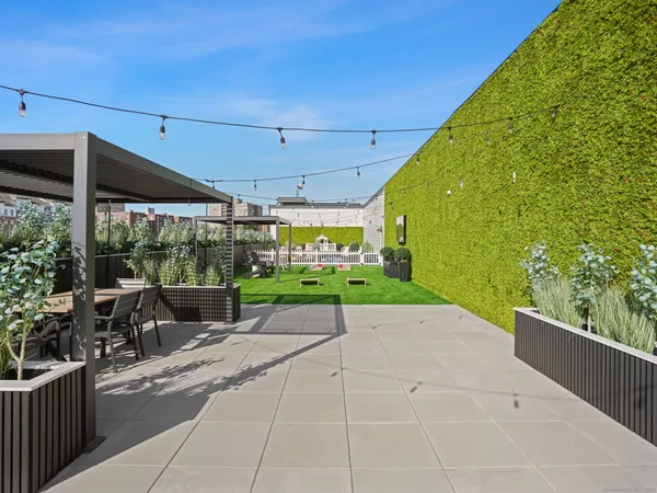 a view of a patio with a backyard