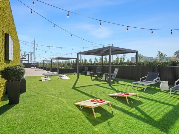 a view of a backyard with sitting area