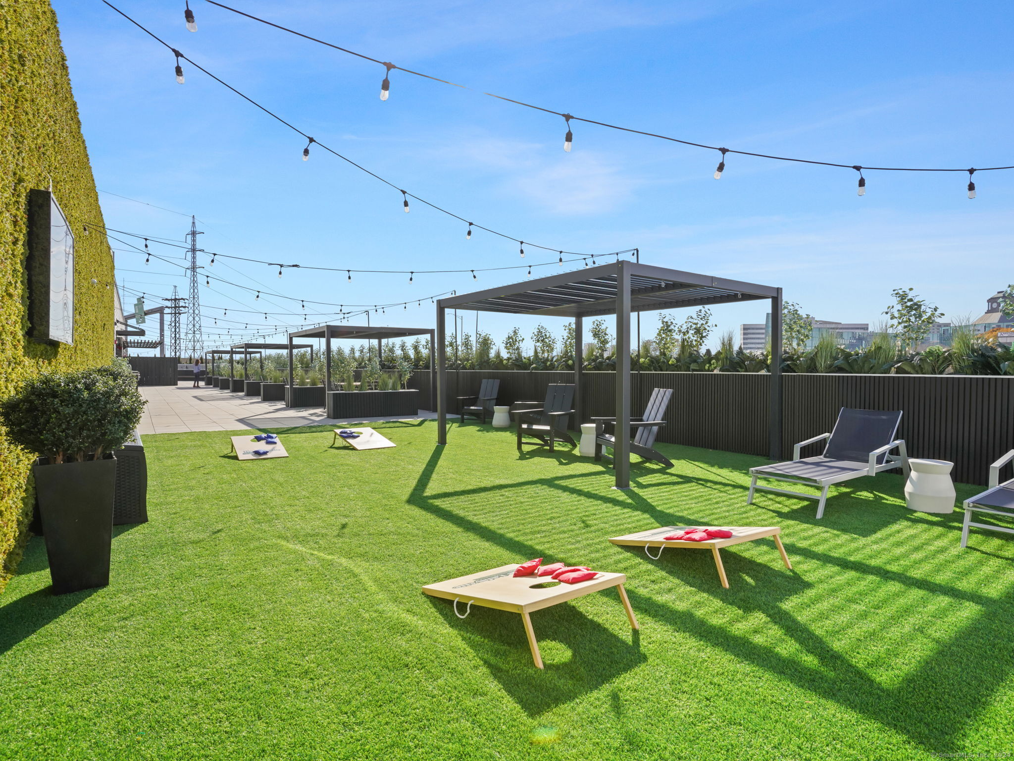 821 East Main Street, Unit 209 Stamford, CT 06902 - Photo 25 of 29 a view of a backyard with sitting area