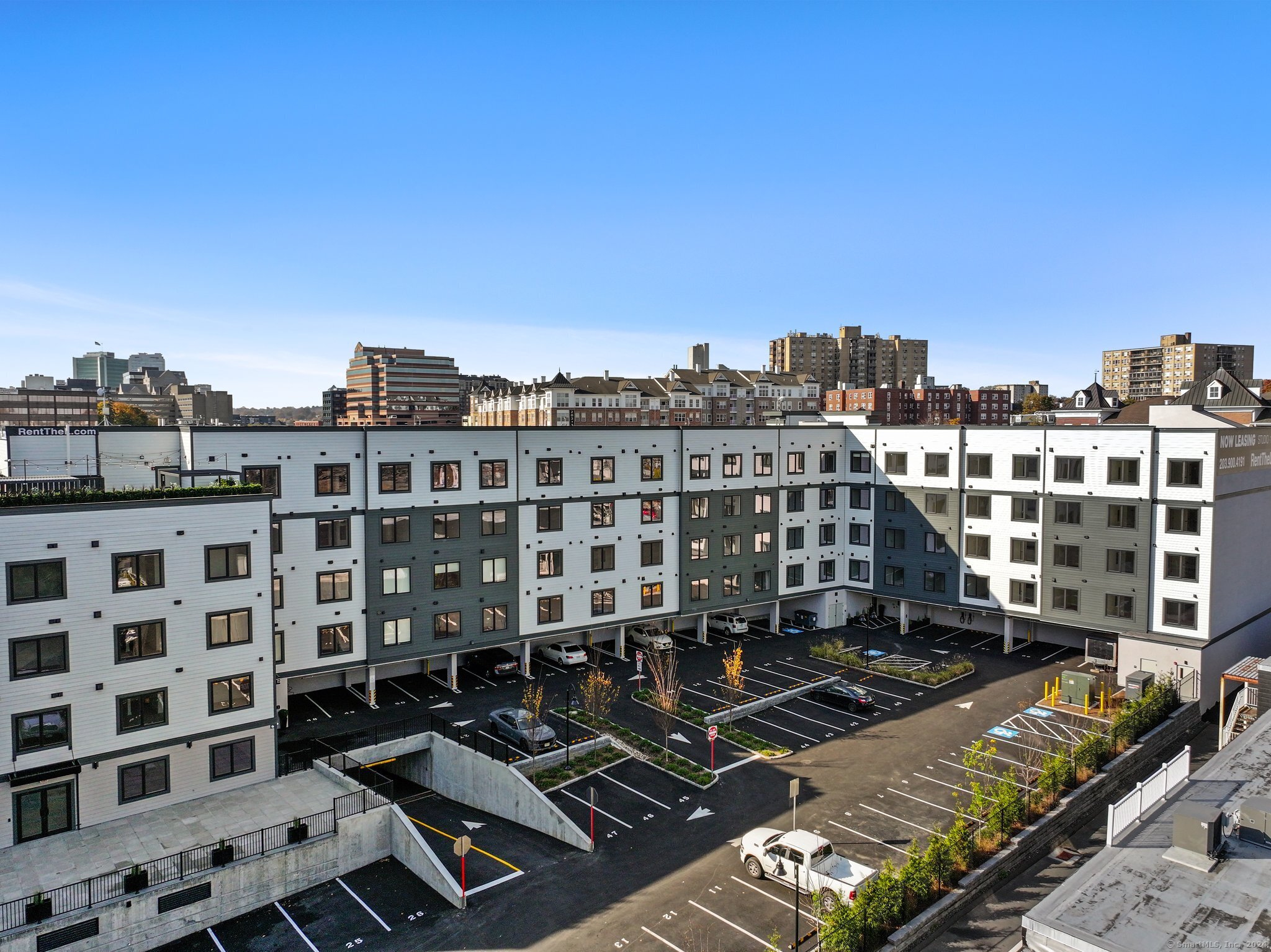 821 East Main Street, Unit 209 Stamford, CT 06902 - Photo 28 of 29 a view of a building with many windows