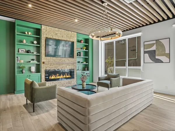 a living room with furniture and a fireplace