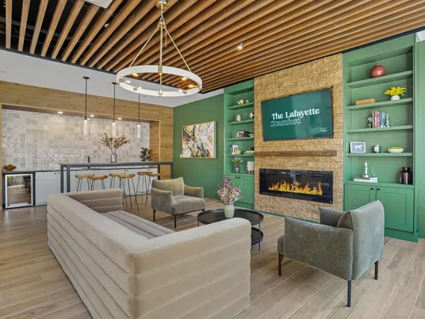 a living room with furniture and a fireplace