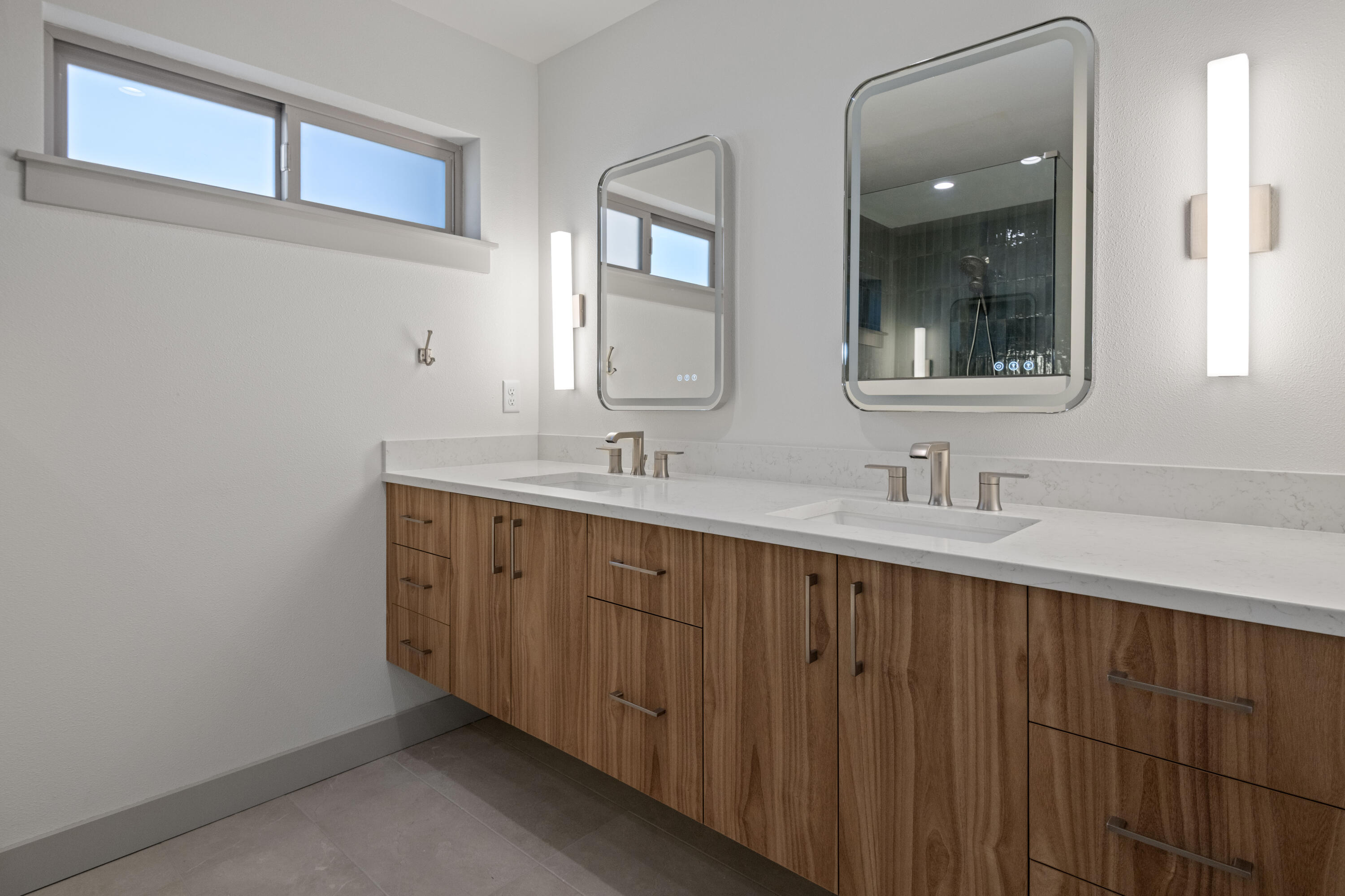 680 Southwest Otter Way Bend, OR 97702 - Photo 39 of 48 a bathroom with a double vanity sink and mirror